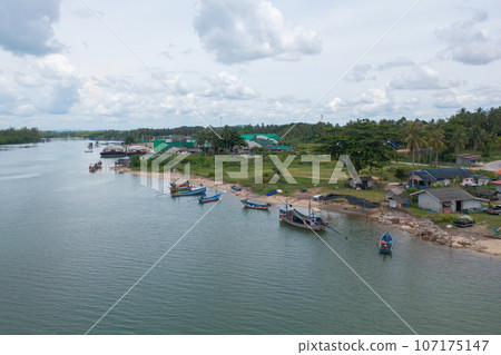 Aerial view of clear blue turquoise seawater, Andaman sea in Phuket island in summer season, Thailand. Water in ocean pattern texture wallpaper background. Aerial view of clear blue turquoise seawater, Andaman sea in Phuket island in summer season, Thailand. Water in ocean pattern texture wallpaper background. 107175147
