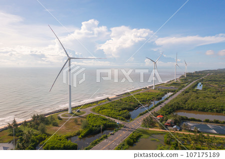Aerial view of wind turbines or windmills farm field and sea shore beach in industry factory. water power, sustainable green clean energy, and environment concept. Nature innovation. 107175189