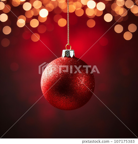 red Christmas ball on a bright background. red Christmas ball on a bright background. 107175383