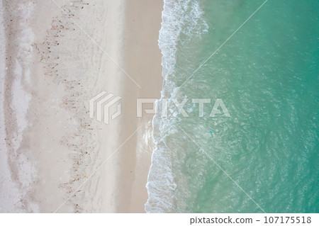 Aerial view of clear blue turquoise seawater, Andaman sea in Phuket island in summer season, Thailand. Water in ocean pattern texture wallpaper background. Aerial view of clear blue turquoise seawater, Andaman sea in Phuket island in summer season, Thailand. Water in ocean pattern texture wallpaper background. 107175518