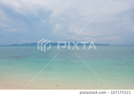 Aerial view of clear blue turquoise seawater, Andaman sea in Phuket island in summer season, Thailand. Water in ocean pattern texture wallpaper background. Aerial view of clear blue turquoise seawater, Andaman sea in Phuket island in summer season, Thailand. Water in ocean pattern texture wallpaper background. 107175521
