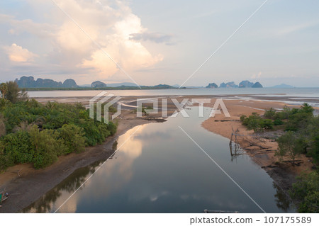 Aerial top view of a garden park with green mangrove forest trees, river, pond or lake. Nature landscape background, Thailand. 107175589