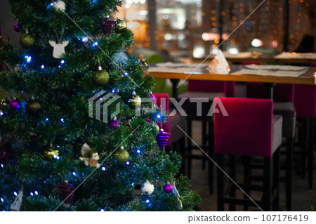 various Christmas decorations on the tree, decorations 107176419