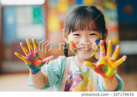 Smiling girl enjoying drawing 107176638