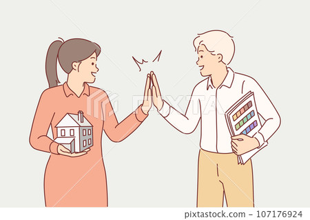 Architects with house layout and palette high five after successfully completing design building Architects with house layout and palette high five after successfully completing design building 107176924