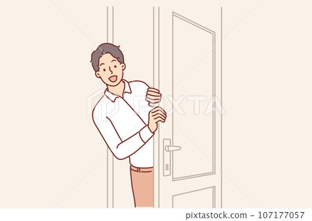 Man opens door and peeks into boss office, asking permission to enter and discuss work matters 107177057
