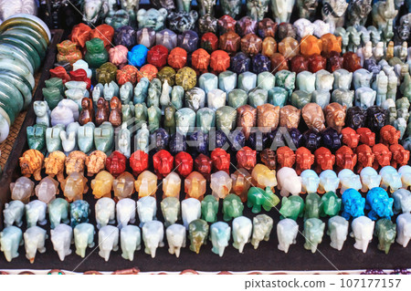 Many small elephants stone figurines at street market, selective focus 107177157