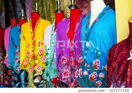 Multicolored womens blouses on headless mannequins at street market 107177158