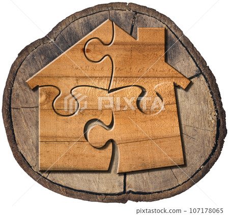 Wooden House Made of Jigsaw Puzzle Pieces on a Tree Trunk Wooden House Made of Jigsaw Puzzle Pieces on a Tree Trunk 107178065