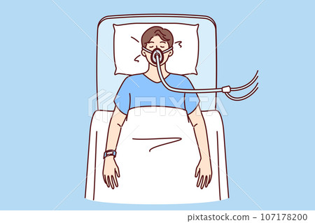 Sick man lies unconscious in hospital bed and receives air through ventilator due to heart attack Sick man lies unconscious in hospital bed and receives air through ventilator due to heart attack 107178200