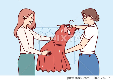 Woman picks up dry-cleaner dress standing in laundry room near employee demonstrating clothes Woman picks up dry-cleaner dress standing in laundry room near employee demonstrating clothes 107178206