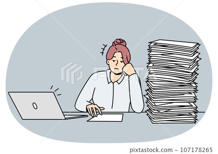 Tired businesswoman with pile of paperwork 107178265