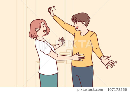 Happy couple embraces at meeting near entrance to house and rejoices at long-awaited date Happy couple embraces at meeting near entrance to house and rejoices at long-awaited date 107178266