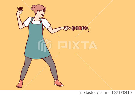 Housewife woman with vegetable kebab stands in swordsman pose and uses skewer instead of sword 107178410