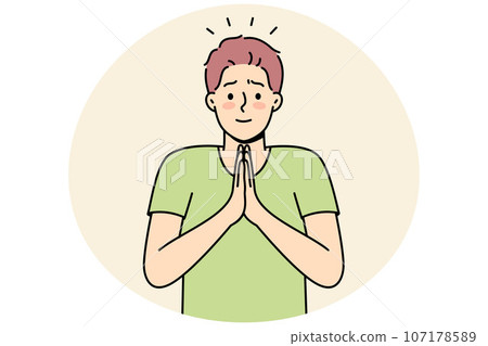 Young man with hands in prayer 107178589