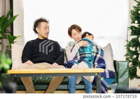 Mother putting her 2-year-old son to sleep Mother putting her 2-year-old son to sleep 107178719
