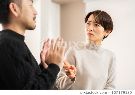 woman blaming her husband 107179180