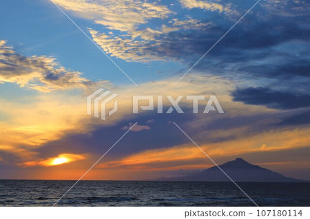 Sunset overlooking Rishiri Island offshore from the Sarobetsu wilderness in Rishiri Rebun-Sarobetsu National Park, Hokkaido, Japan's largest high-rise wetland 107180114