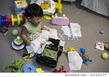 Children Messy Playing In The Living Room, background for the ad and wallpaper in the children and family scene. Actual images in decorating ideas 107181157