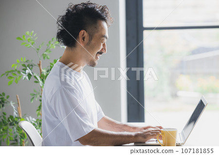 A man working in a natural style office 107181855