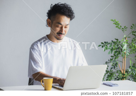 A man working in a natural style office A man working in a natural style office 107181857