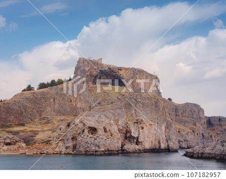 Rhodes, Greece. Lindos small whitewashed village and the Acropolis, scenery of Rhodos Island at Aegean Sea. St. Pauls bay 107182957
