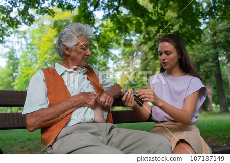Nurse injecting insulin in belly of diabetic senior patient. Nurse injecting insulin in belly of diabetic senior patient. 107187149