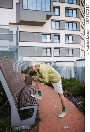 Senior man exercising outdoors in the city Senior man exercising outdoors in the city 107187217