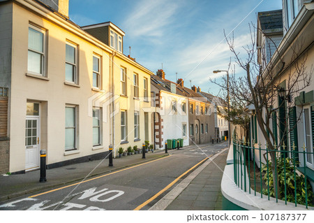 Street with small houses along the road, Belozanne, bailiwick of Jersey, Channel Islands 107187377