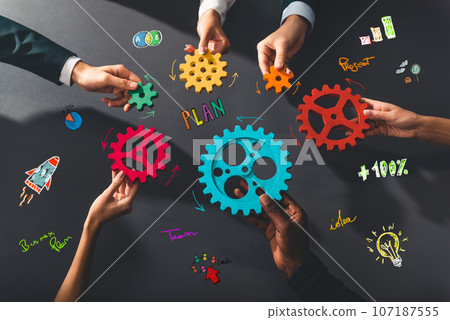 Business team work together and combine pieces of gears. Partnership and integration concept Business team work together and combine pieces of gears. Partnership and integration concept 107187555
