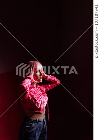 Doll woman, surreal portrait of a model with pink hair Doll woman, surreal portrait of a model with pink hair 107187941