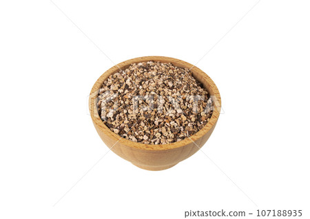 Bistorta officinalis known as bistort, common bistort, European bistort or meadow bistort in wooden bowl isolated on white background. 107188935