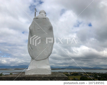 White statue of Saint Patrick at the start of foot path to the peak of Croagh Patrick, county Mayo, Ireland White statue of Saint Patrick at the start of foot path to the peak of Croagh Patrick, county Mayo, Ireland 107189591