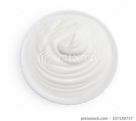 sour cream or yogurt in ceramic bowl isolated on white background with full depth of field. Top view. Flat lay 107189737