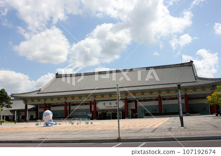 Jinju-si, Gyeongsangnam-do, South Korea September 8, 2023: KTX train station with tiled roof in traditional Korean architecture in Jinju-si Jinju-si, Gyeongsangnam-do, South Korea September 8, 2023: KTX train station with tiled roof in traditional Korean architecture in Jinju-si 107192674