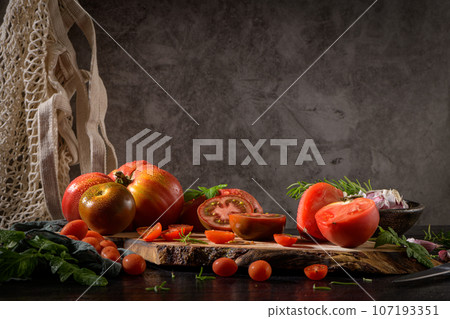Tomatoes on rustic kitchen counter Tomatoes on rustic kitchen counter 107193351
