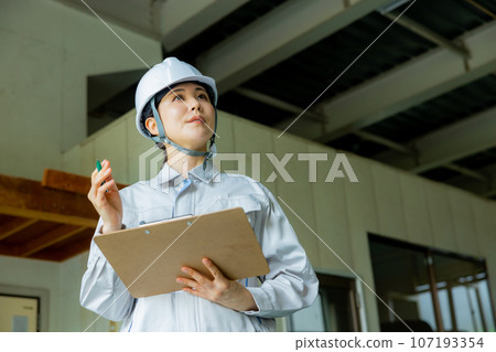 Women in work clothes, helmet Women in work clothes, helmet 107193354
