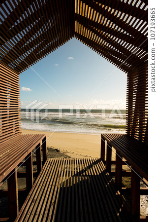 Relaxing view from a seashore bench 107193665
