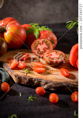 Tomatoes on rustic kitchen counter 107193717