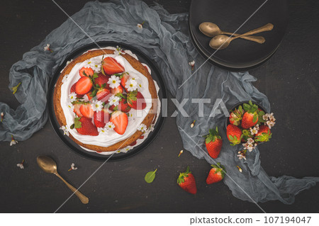 Sponge cake with fresh strawberries Sponge cake with fresh strawberries 107194047