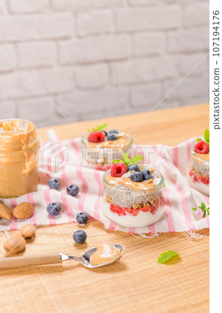 Chia pudding with oat and berries 107194176