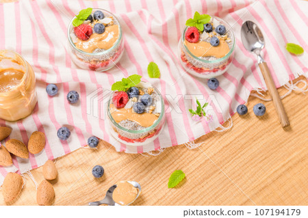 Chia pudding with oat and berries 107194179