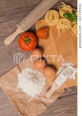 Raw pasta, tomato and eggs 107194502