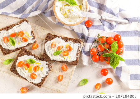 Rye bread bruschetta 107194803