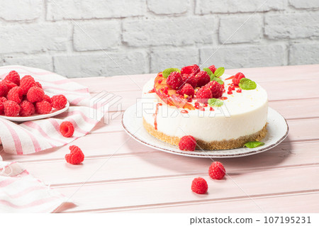 Cheesecake with fresh raspberries and plums 107195231