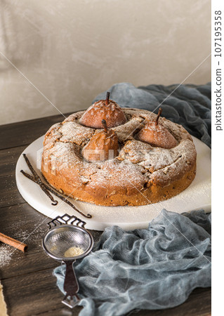 Delicious cake with pear and cinnamon Delicious cake with pear and cinnamon 107195358