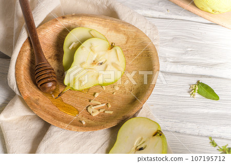 Tasty pears with honey and nuts Tasty pears with honey and nuts 107195712