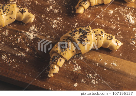 Raw croissant with ingredients 107196137