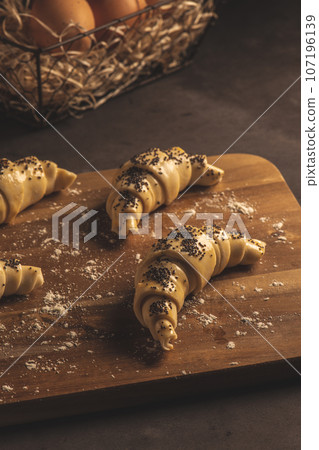 Raw croissant with ingredients 107196139