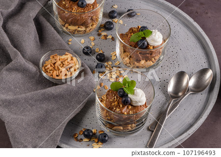Glass cups of chocolate and chestnuts mousse 107196493